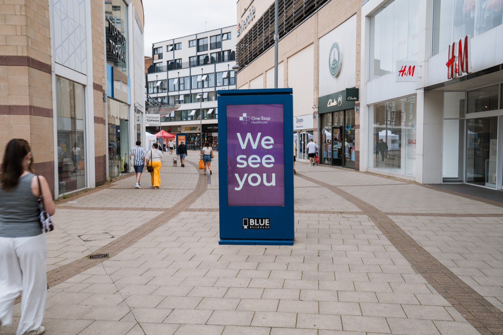 Digital out-of-home advertising totem installed on a UK high street