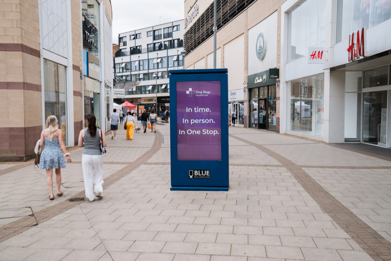 Digital out-of-home advertising totem in a retail shopping precinct
