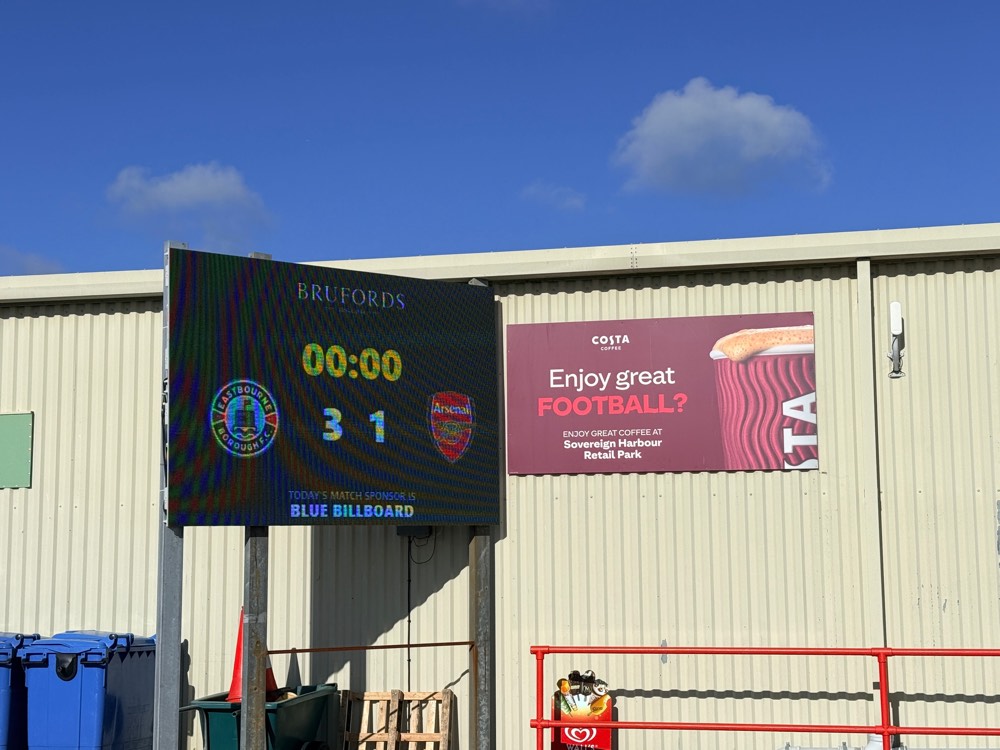 LED scoreboard showing the score at a football ground