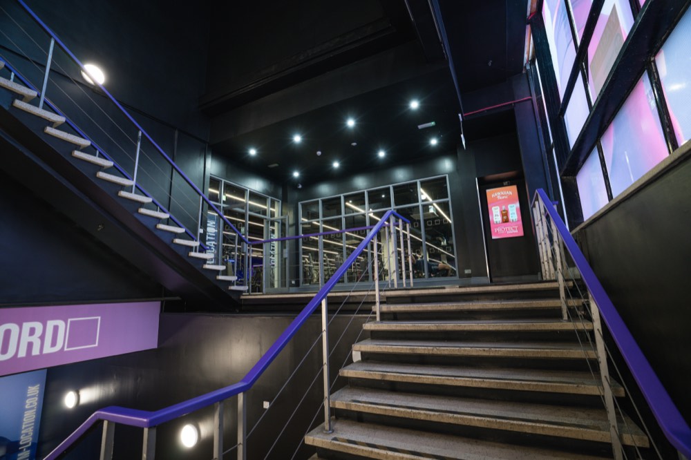 Stairway with digital signage screens in a fitness club